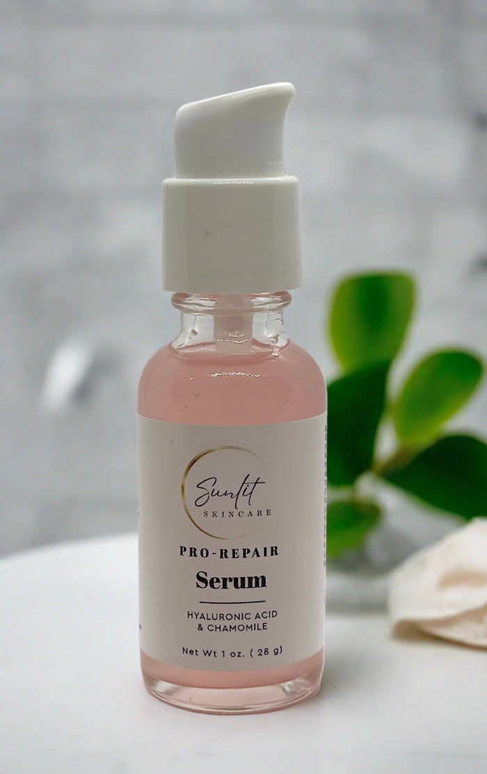 Sunlit Pro-Repair Serum bottle with greenery in the background